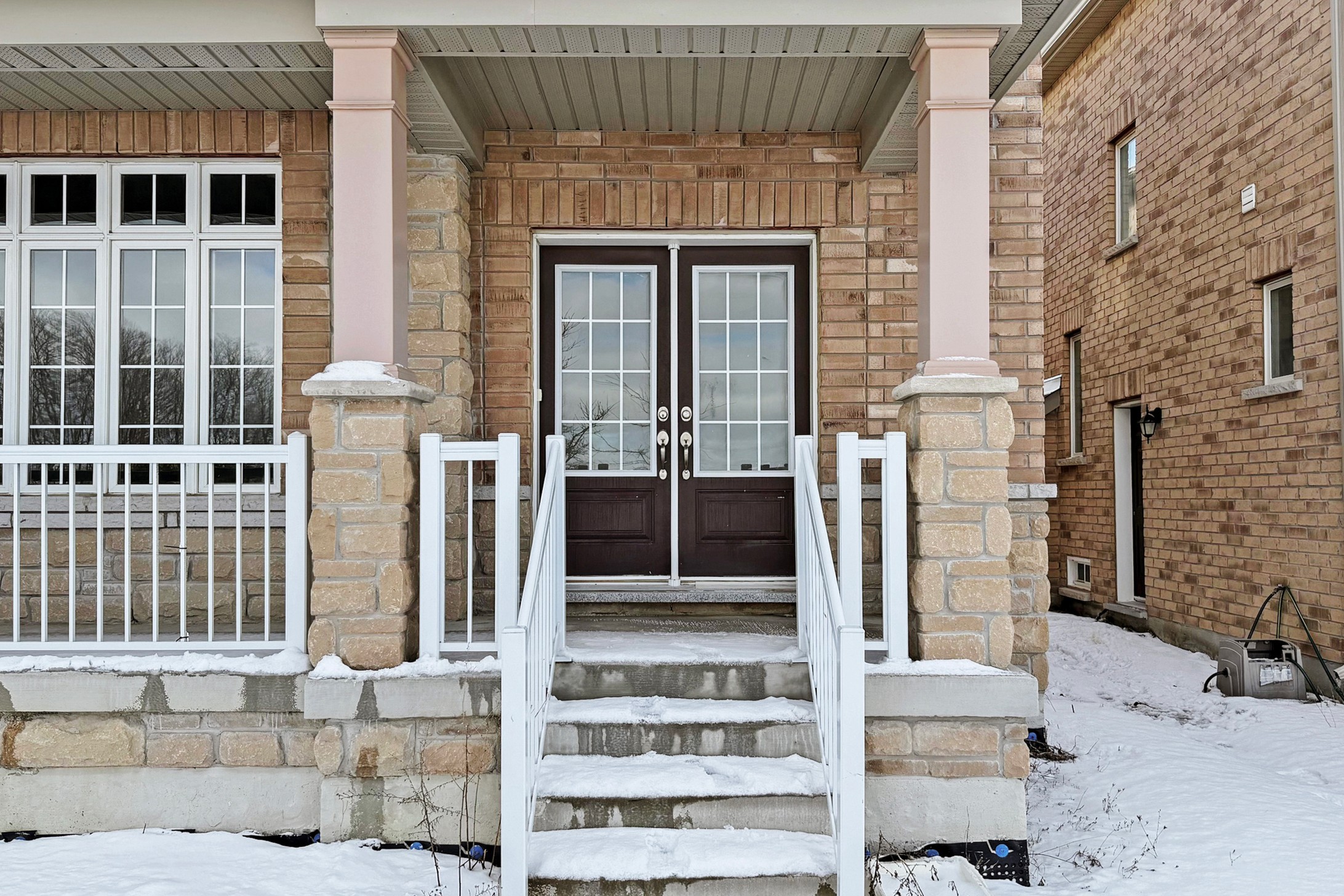 Double front door entry with stone porch