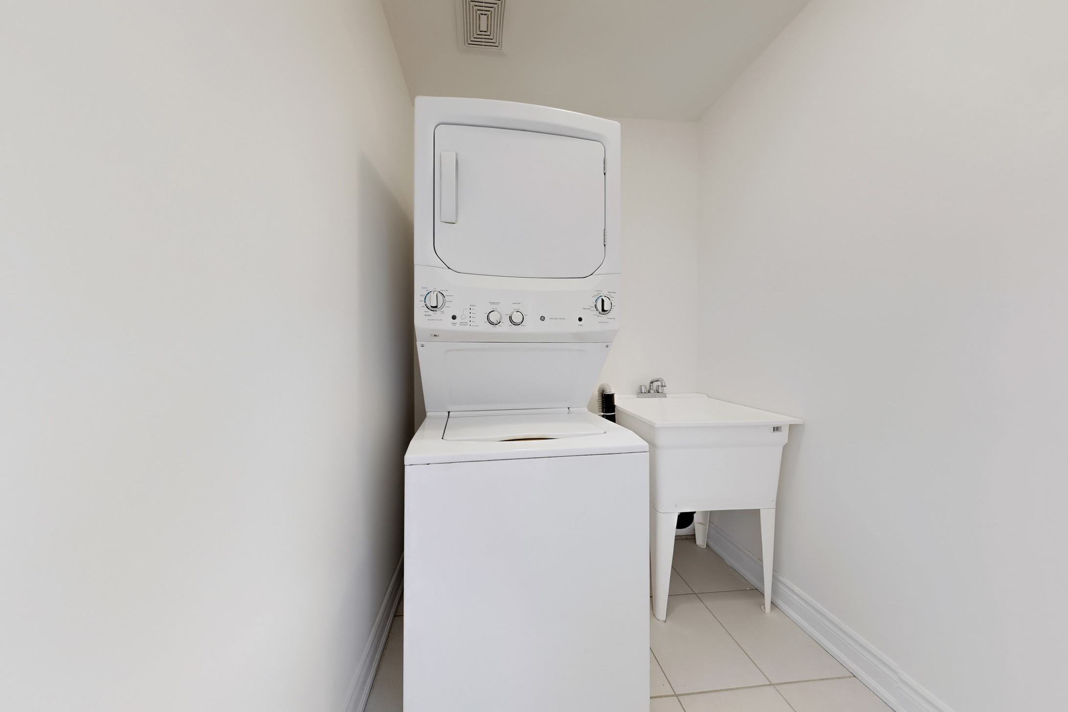Upper level laundry with stacked washer and dryer