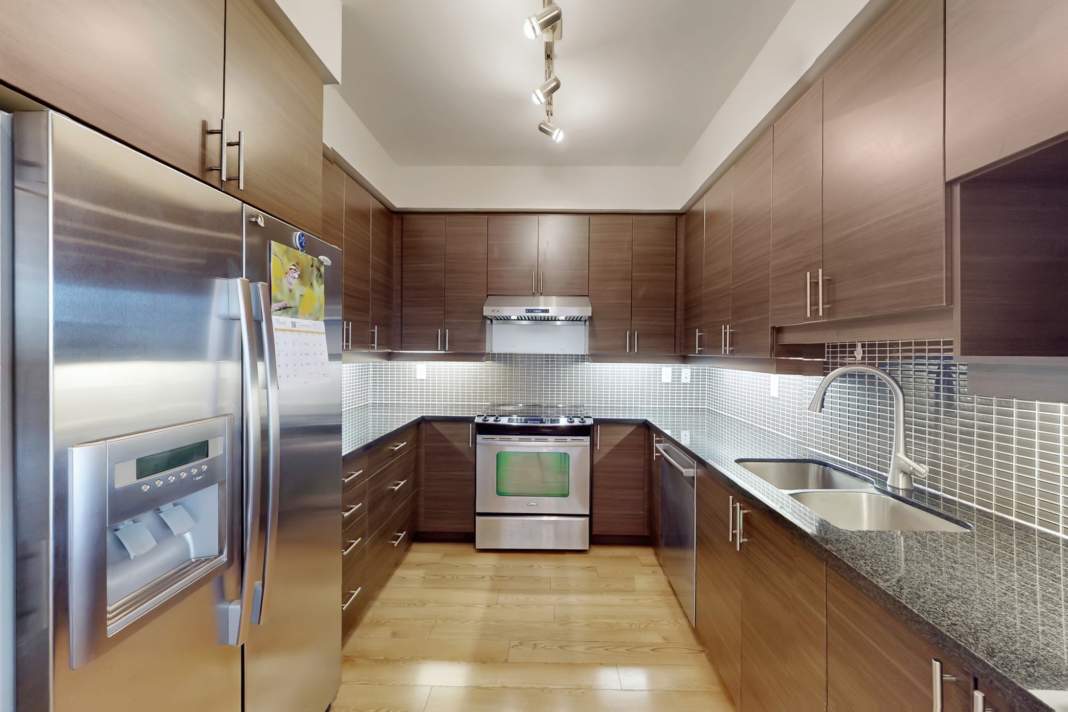 Modern kitchen with granite counters and stainless steel appliances